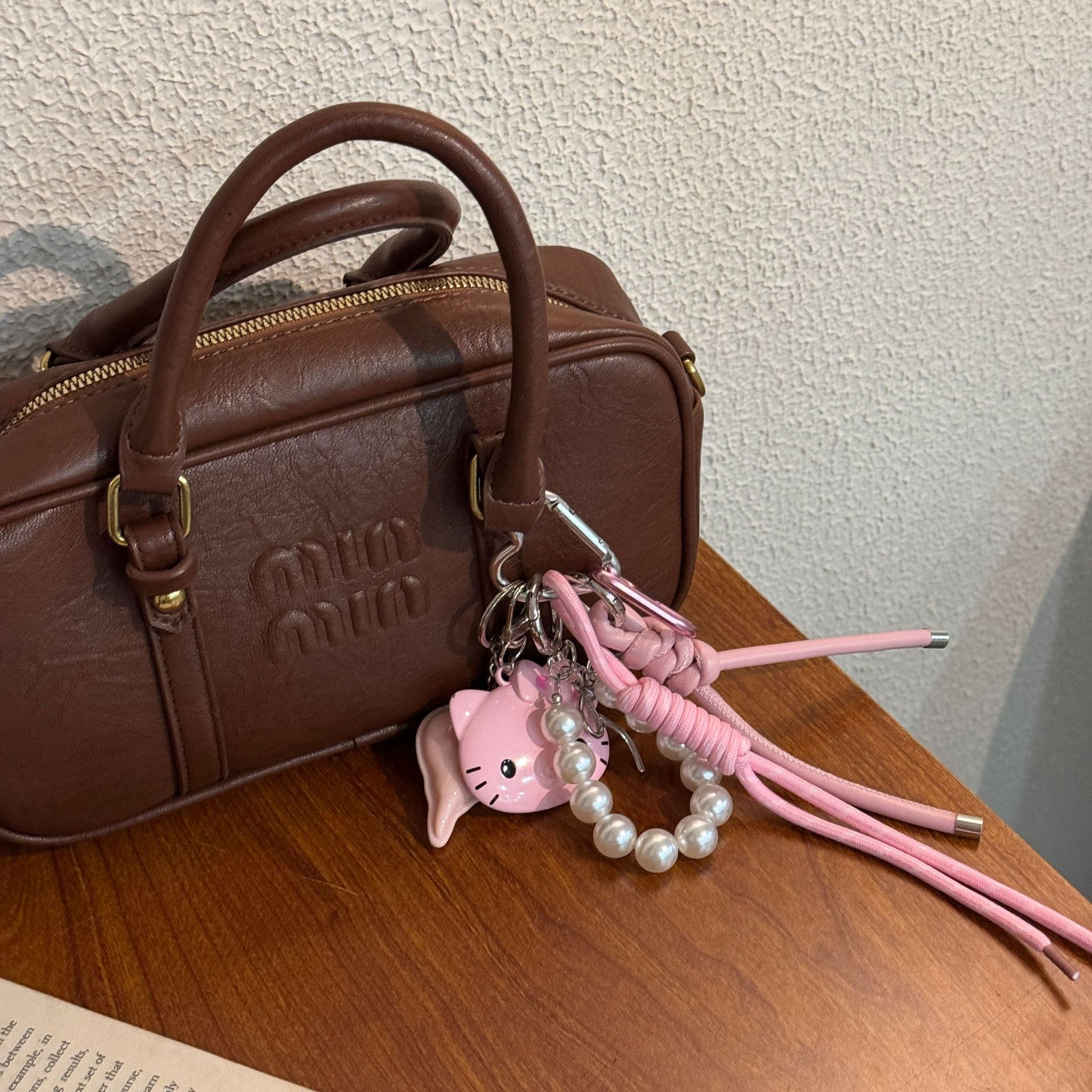 Original DIY hecha a mano colgante rosa KT gato personalidad bolso colgante Miu pareja trenzado colgante bolso colgante