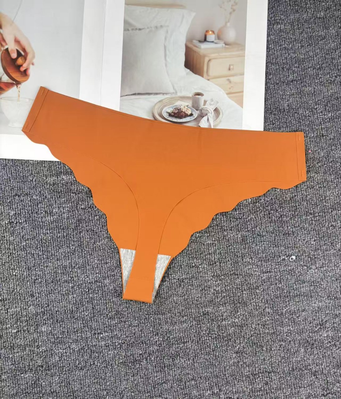 Inventario de bajo precio de alta calidad tanga sin costuras europea y americana ropa interior sexy para mujer 11001