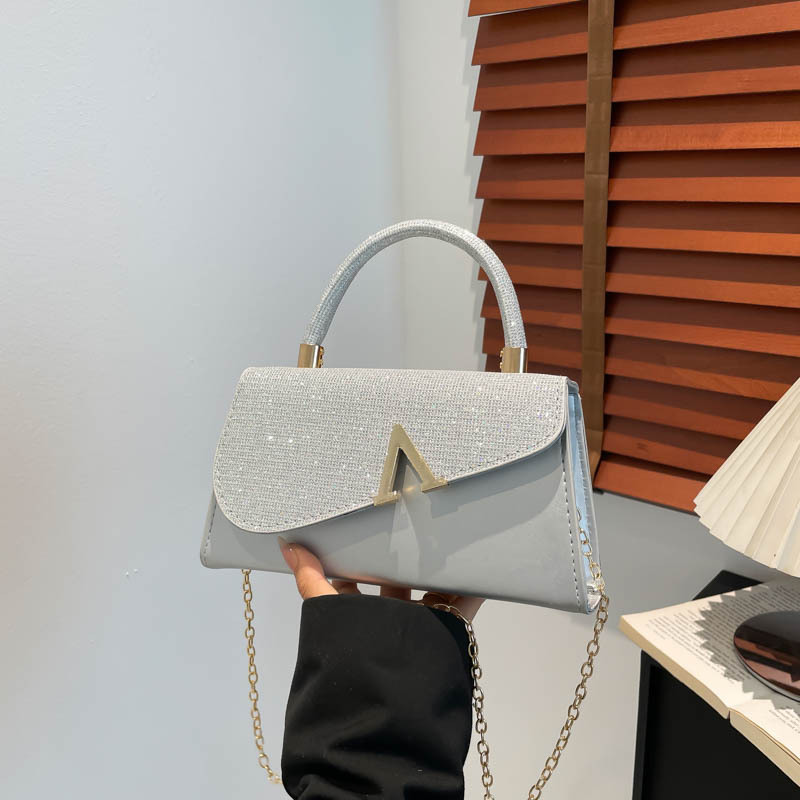 Bolso femenino transfronterizo simple europeo y americano 2025 nuevo bolso de cena de moda en forma de V de moda bolso de diamantes de imitación brillante de alto valor