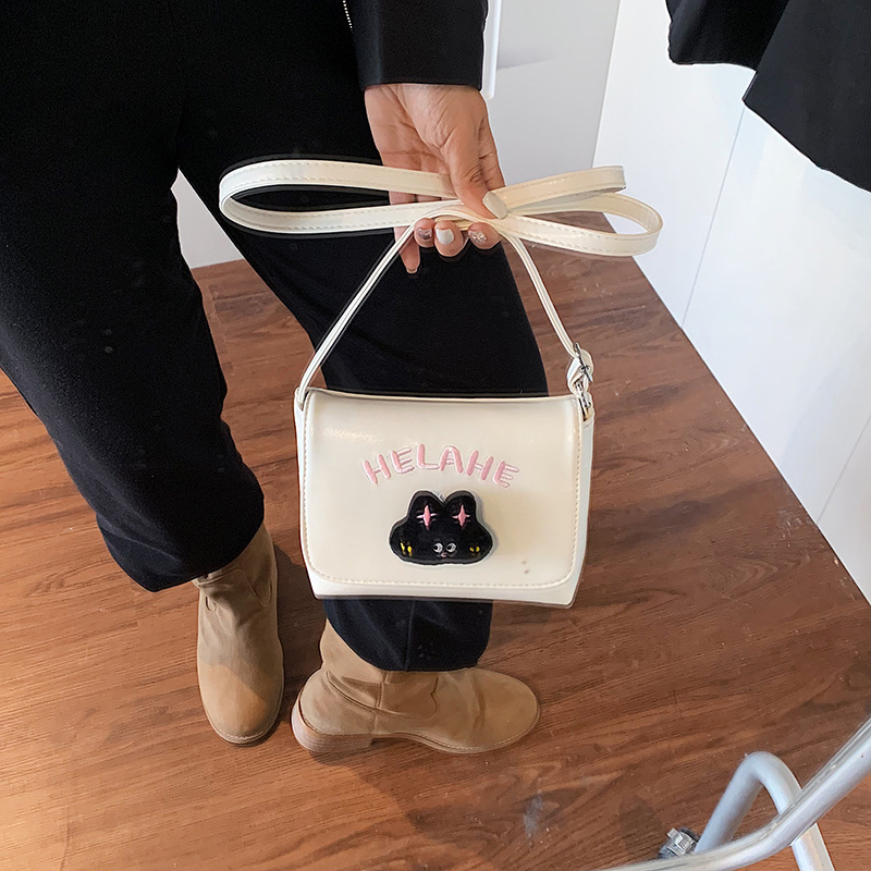 Caricatura lindo gatito niñas y niños bolsos de hombro letras extranjeras bolsos de bebé otoño y invierno nuevos bolsos de niños