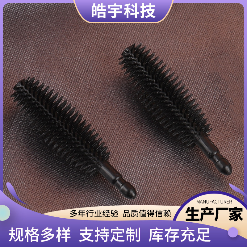 The manufacturer supplies disposable olive-shaped eyelash brush…