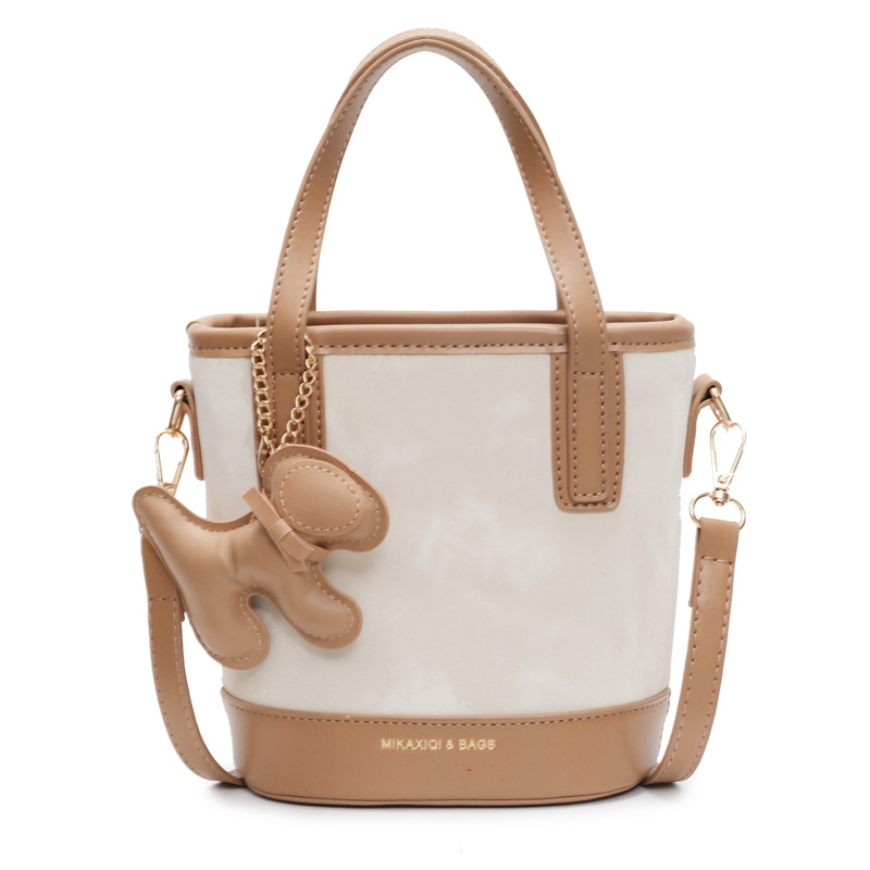 Este año, la popular bolso de mano super caliente para mujeres 2025 nuevo bolso de cubo retro versátil de alto nivel sensación de hombro mochila