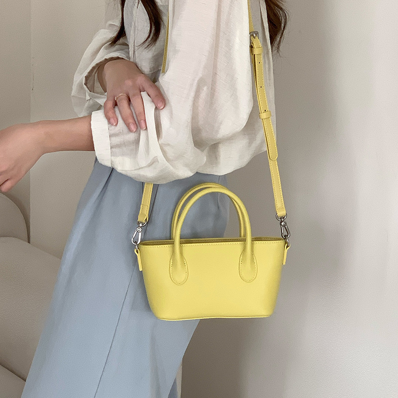 Mini bolsa de cesta de verduras de cuero minimalista 2025 nuevo estilo de piel de vaca Xiaozhong lingote bolso de mensajero portátil bolso de hombro femenino