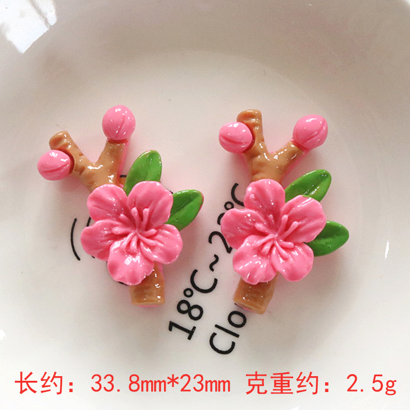 Nuevos accesorios de bricolaje de flor de durazno de resina rosa, zapatos con agujeros de pegamento de crema, fundas para teléfonos móviles, accesorios para el cabello, material de imán para refrigerador al por mayor