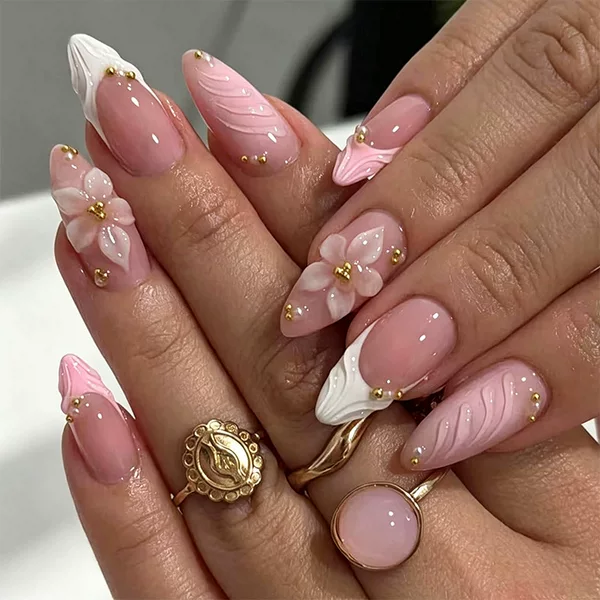Cross-border best-selling wearable nails in gentle nude pink with embossed flowers, pointed tips, and luxurious gold beads, finished nail art for a classy look, wholesale