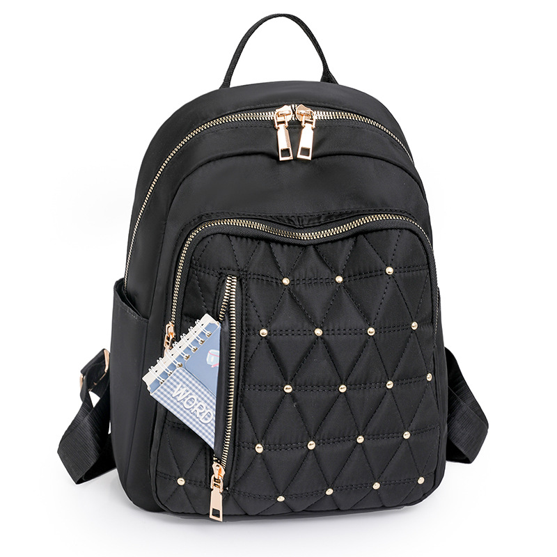 Mochila de nailon bordada de rombo para mujer 2024 nuevo estilo casual para mujer mochila de viaje ligero para viajeros urbanos