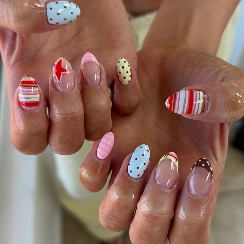 Short almond-shaped nails in an ins-style French design with colorful stripes, polka dots, and stars, Y2K press-on false nails
