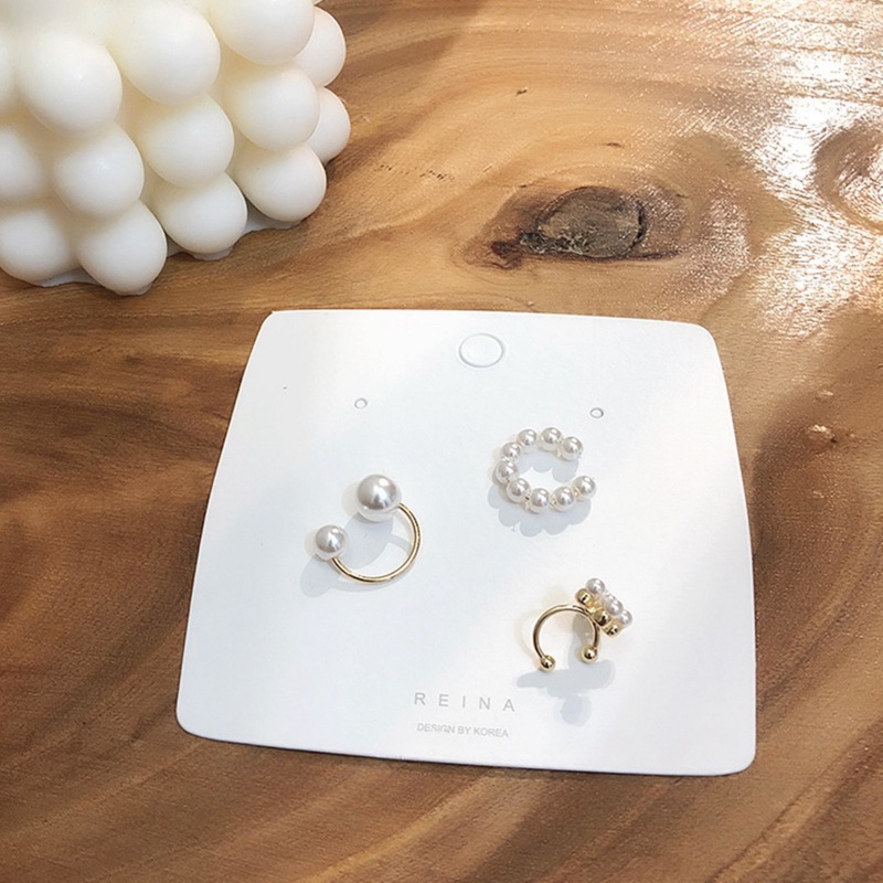 Clip de oreja nueva moda de moda diseño personalizado perla oreja clip de hueso temperamento femenino todo partido conjunto de tres piezas pendientes al por mayor