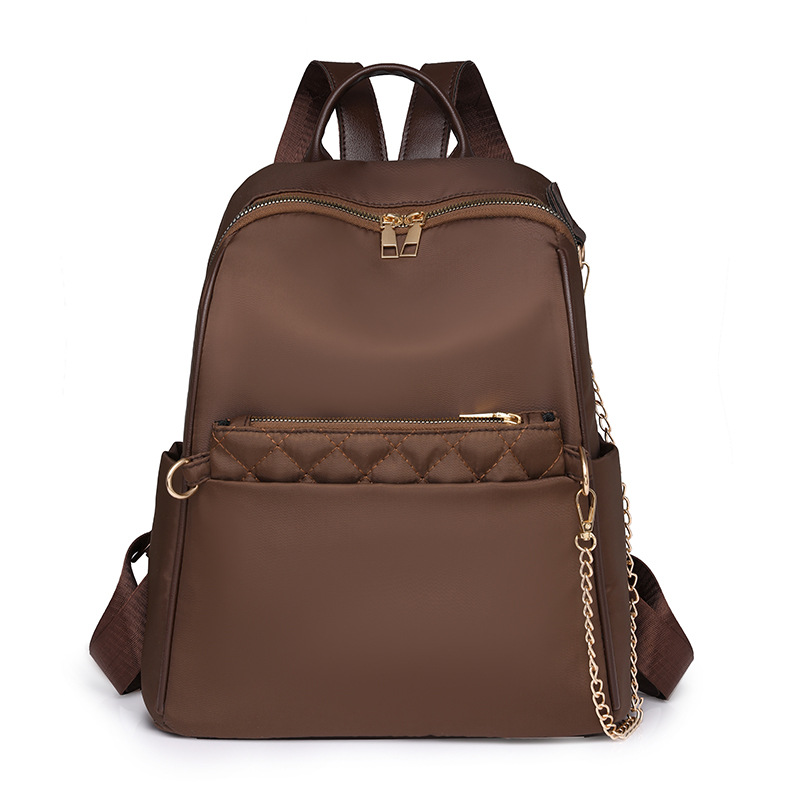 2024 otoño nueva cadena de moda para mujer mochila de nailon simple y versátil mochila de viaje ligera al aire libre marea