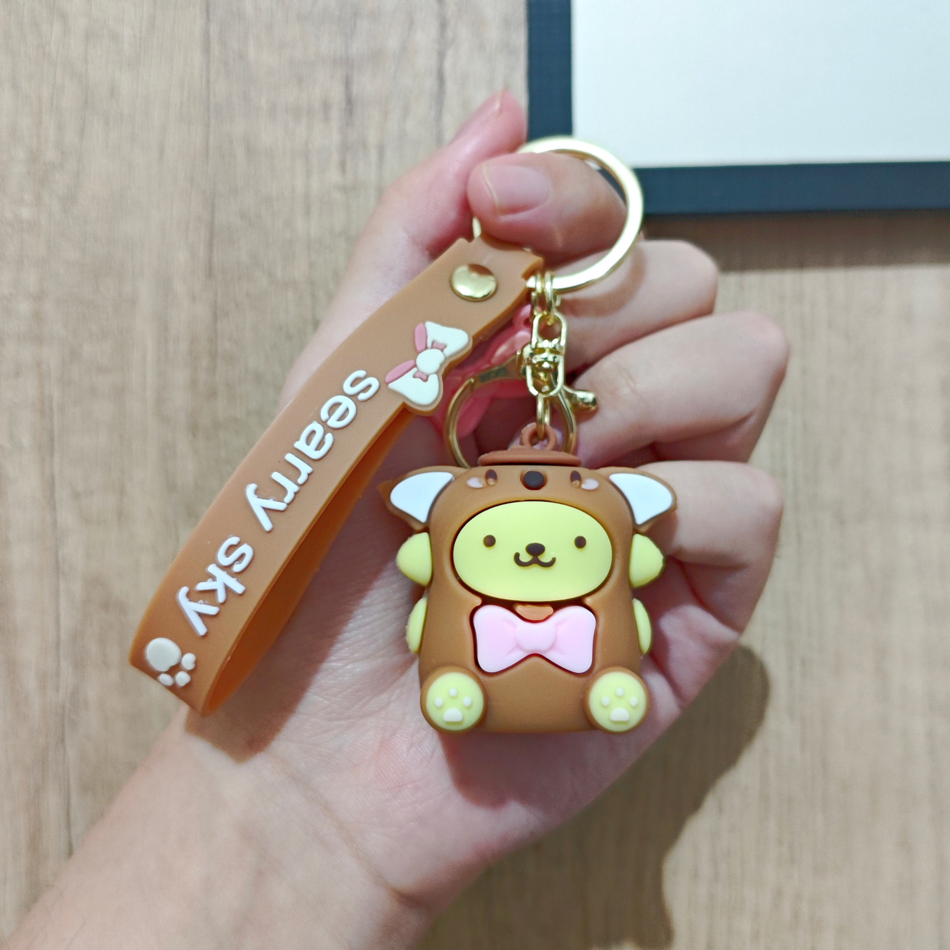 Perro de orejas grandes Melody KT gato pudín perro Kolomi caricatura de silicona llavero colgante bolsa colgante caja ciega regalo