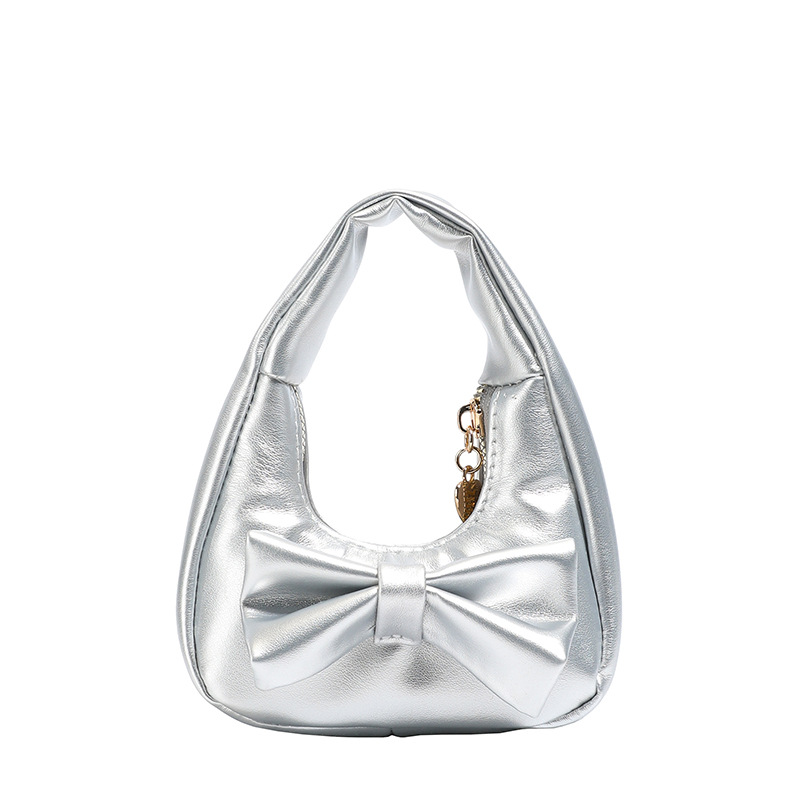 Dolce y lindo arco bolso de niña exquisita mini bolso de cambio de bebé 2025 bolso infantil transfronterizo