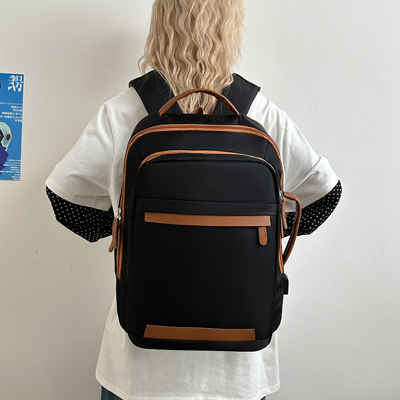 Nueva mochila de viaje de gran capacidad, resistente al agua y al desgaste, mochila de computadora simple informal, bolso de viaje de moda ligero