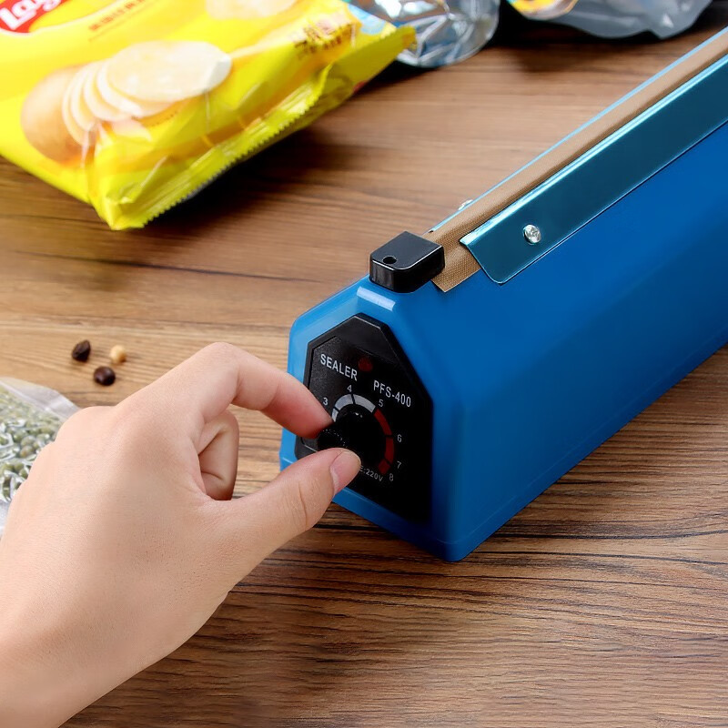 Máquina de sellado de prensa manual, máquina de envasado de bolsas de té, máquina de sellado de plástico manual doméstica, máquina de sellado de prensa en stock image 4