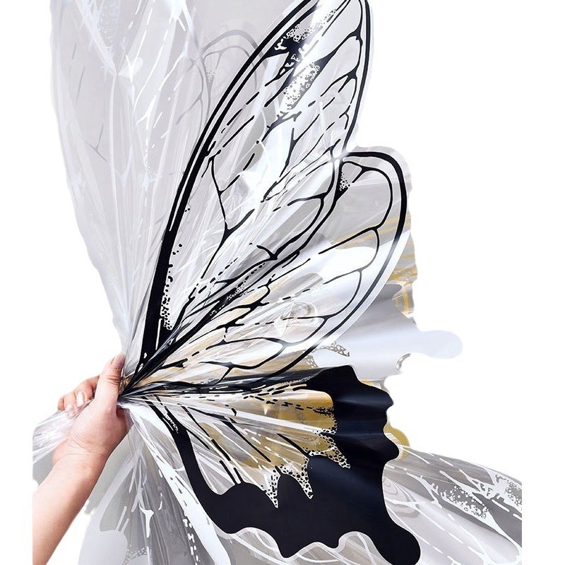 Fábrica de fiestas de flores de venta caliente creativo transfronterizo nuevo papel de embalaje de flores de mariposa transparente ramo de flores papel de embalaje