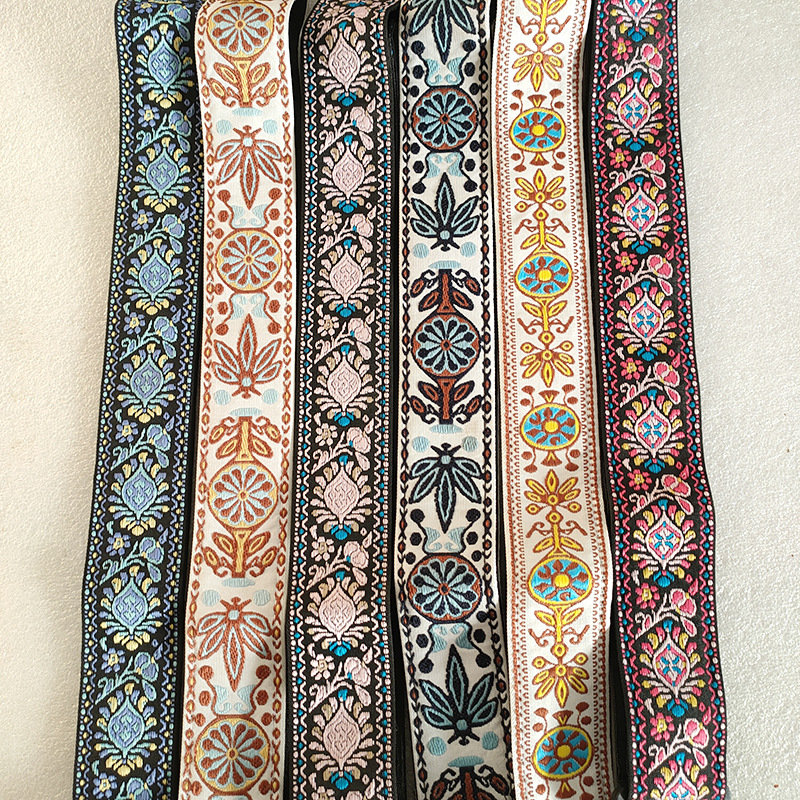 Factory-direct supply of musical instrument accessories—wholesale thickened and widened instrument straps, featuring ethnic-style woven ribbon with embroidered guitar straps.