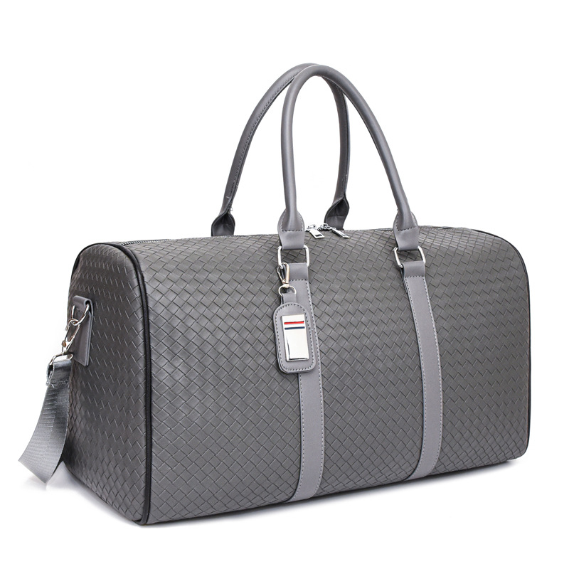 2024 Bolso de viaje portátil tejido nuevo transfronterizo de ocio de gran capacidad anti-salpicaduras de agua Bolso de equipaje de viaje de negocios de corta distancia