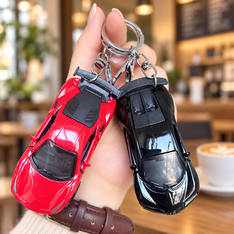 Creative simulated pull-back sports car keychain, cartoon backpack car ornament, children's backpack accessory, grabber toy, small gift