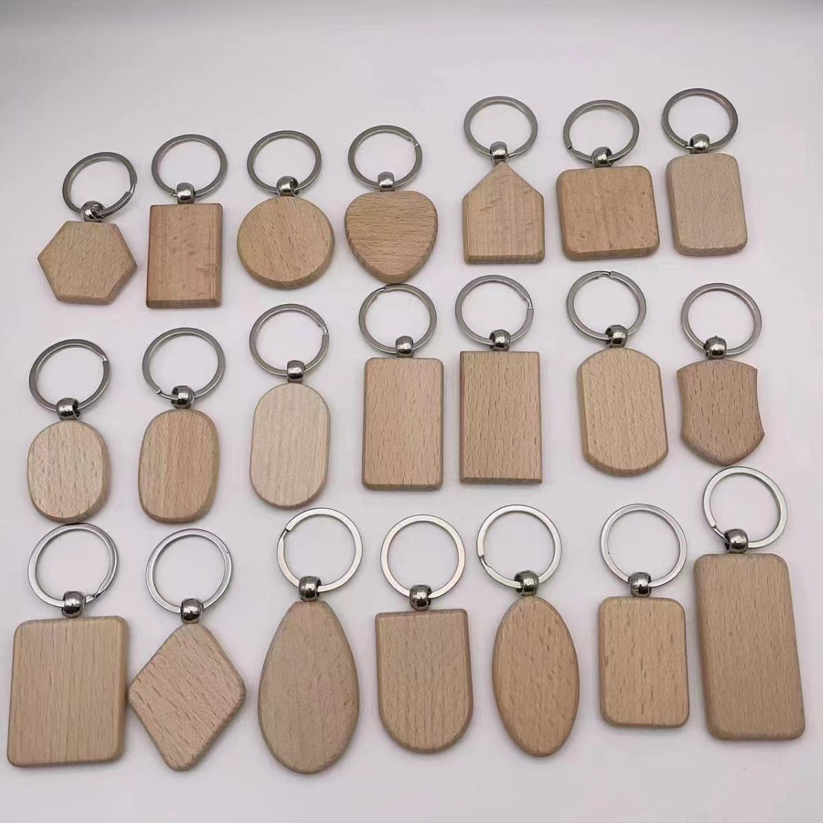 Keychain de madera de haya impresión láser creativa de pequeños regalos fabricantes suministro de keychain de madera