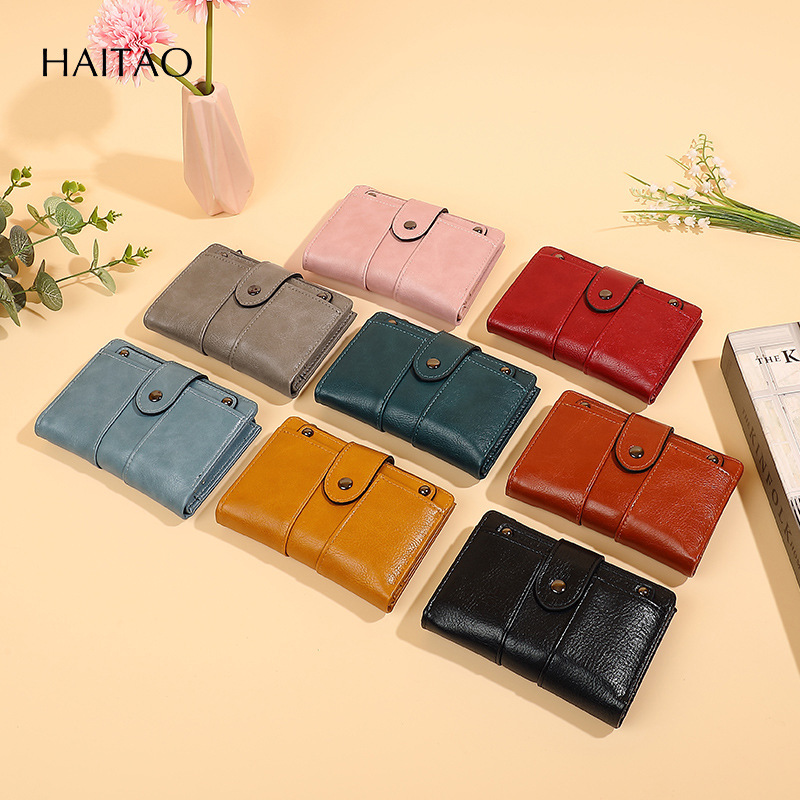 2025 nueva billetera retro de alta gama monedero de cuero dos veces corto con múltiples tarjetas, billetera de mujer