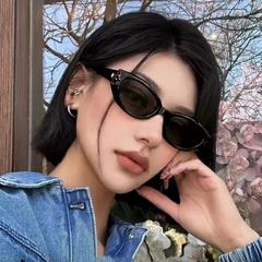 女性用の新しい黒のGMサングラス、男性用のハイエンドメガネ、運転用日焼け止め、UVカット、ストリート撮影用キャットアイサングラス
