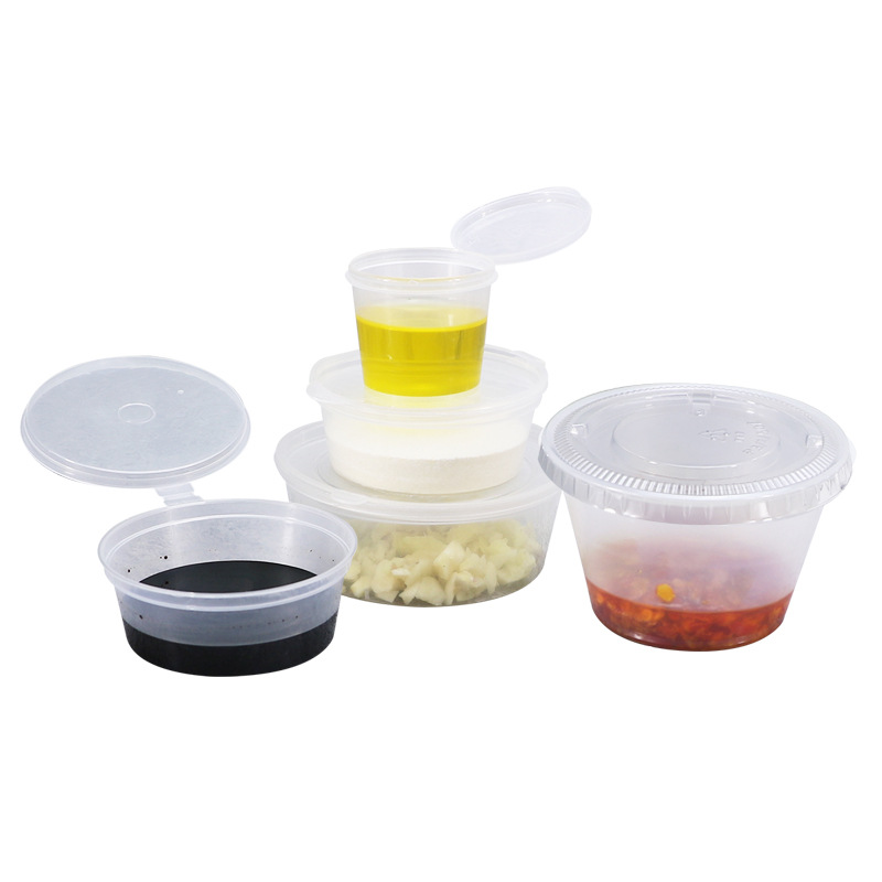 Taza de salsa desechable con tapa hogar Bento caja pequeña redonda taza de salsa de soja condimento caja pequeña para llevar plato de Chile de una pieza