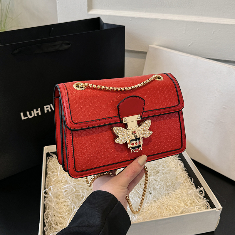 歐美純色蛇紋流行單肩包2024新款可愛珍珠蜜蜂手提包鏈條斜挎女包