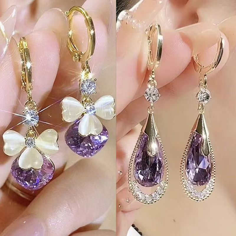 Pendientes de gota de agua morada de pétalo de ópalo de temperamento de lujo ligero, diseño de nicho femenino, moda y todo fósforo