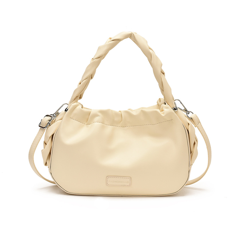 Corea del Sur nueva bolsa de mano plegada mujer 2026 primavera nicho versátil bolso de mochila simple de moda bolsa de nube de viaje