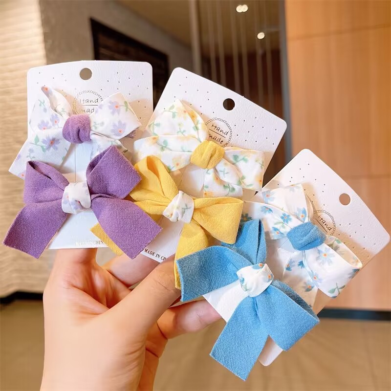 Clip de arco para niños primavera y verano nuevo clip de pico de pato fresco traje estudiante flequillos clip horquilla del corazón de la niña