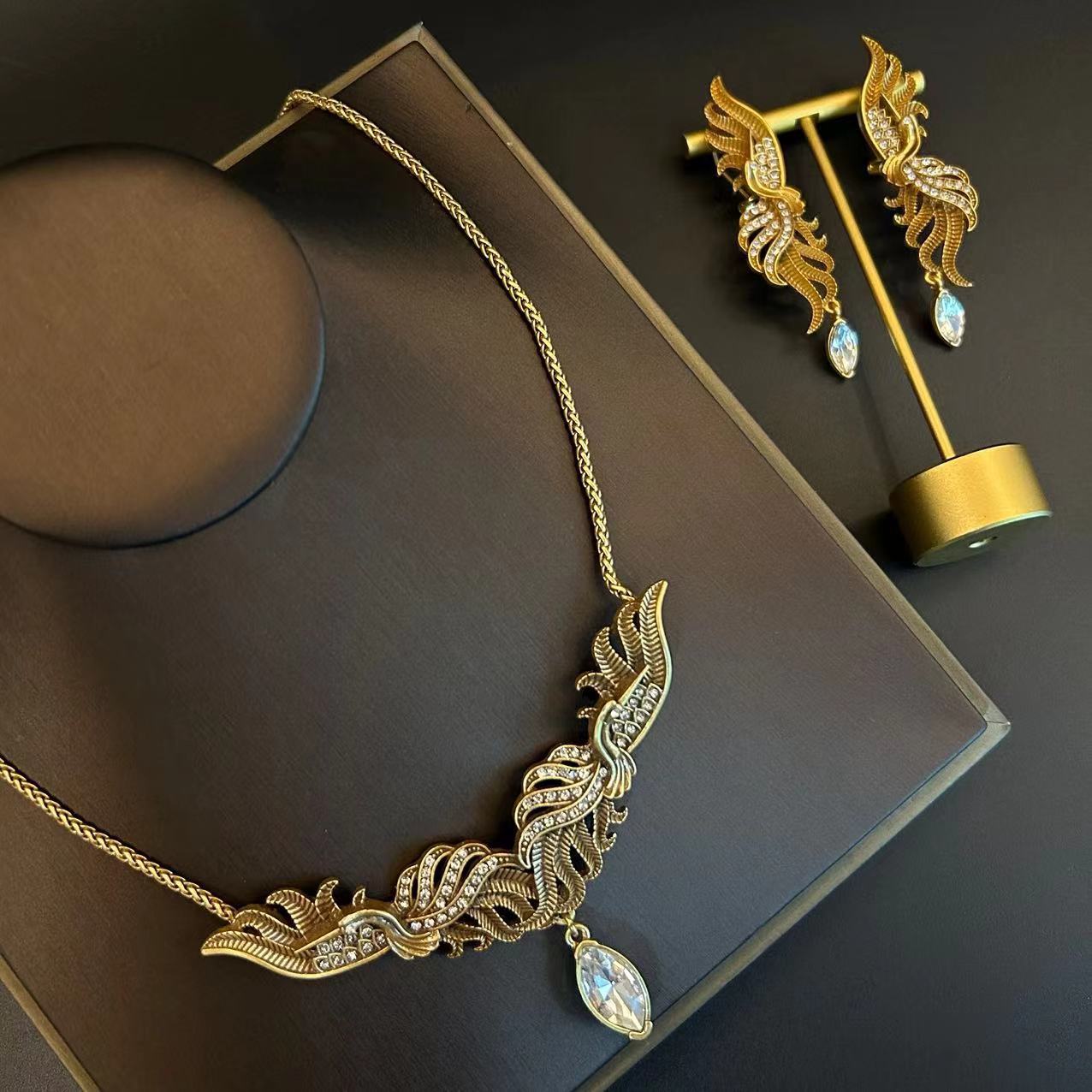 Set gioielli vintage collana e orecchini fenice con diamanti_voghion.com