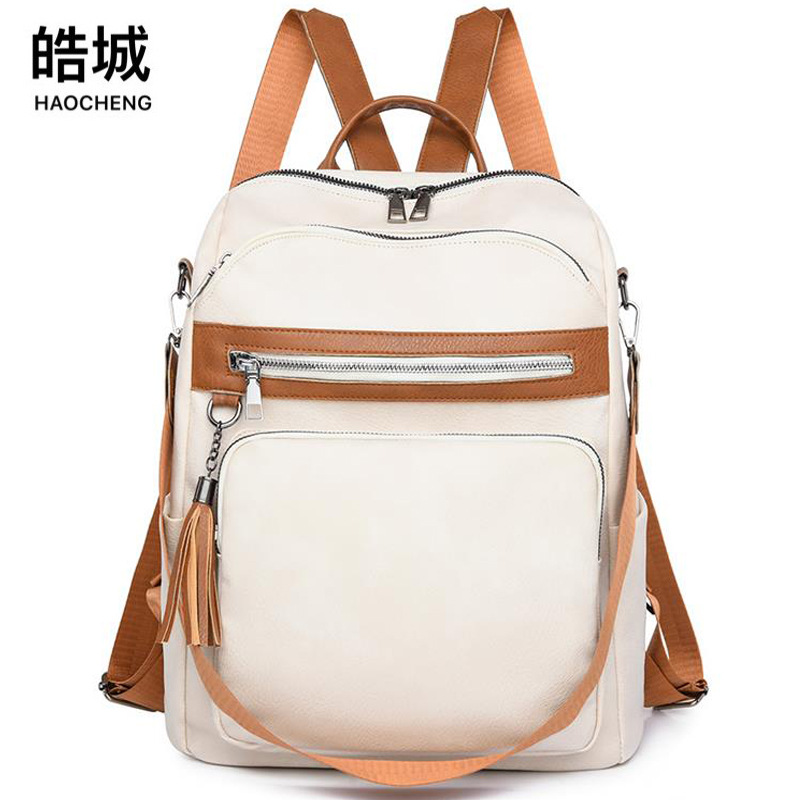 Mochila de cuero suave para mujer casual de verano de alta calidad, color de contraste simple, mochila de doble uso para viajes al aire libre al por mayor