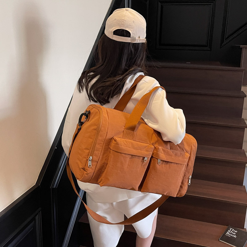 Bolsa de viaje de gran capacidad de textura retro bolso de almohada de moda 2025 nuevo bolso de hombro universal bolso de viaje