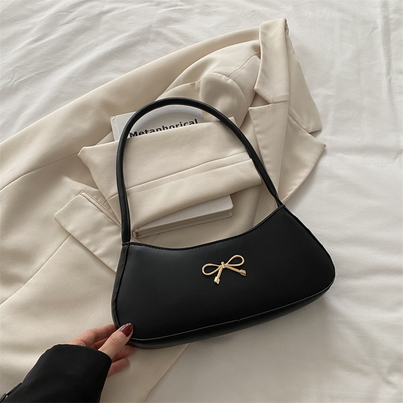 Bolso de axila con lazo para mujer 2025 nuevo bolso de bola de masa de lujo simple y ligero de alta calidad textura bolso de mensajero de un solo hombro marea