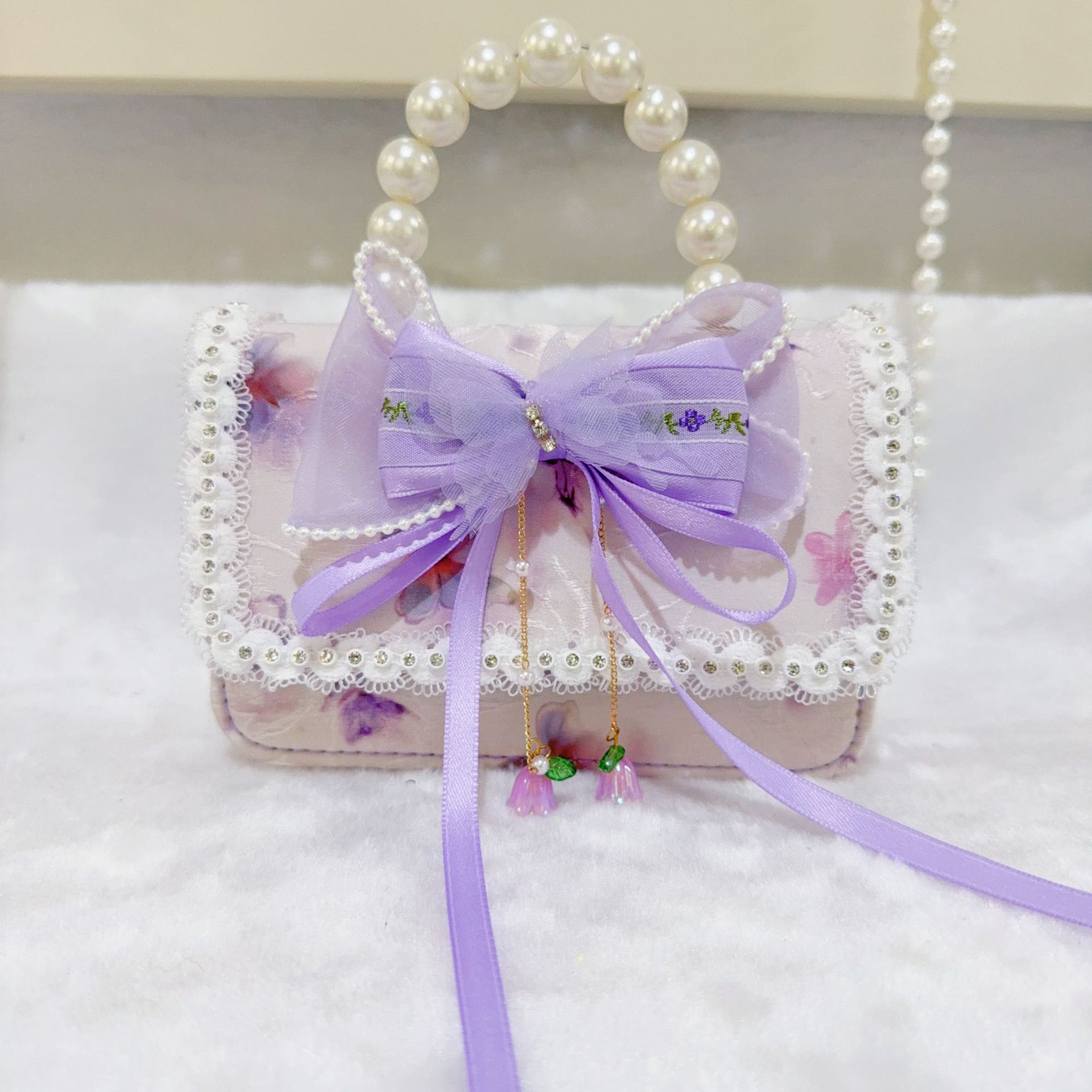 Otoño nuevo bolso infantil princesa perla bolso de mano pequeña fragancia chica bolso de moda bebé portátil