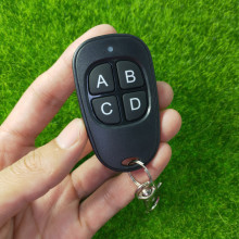 黑色鴨蛋型對拷四鍵電動車門禁電動門鑰匙燈具開關無線遙控器拷貝