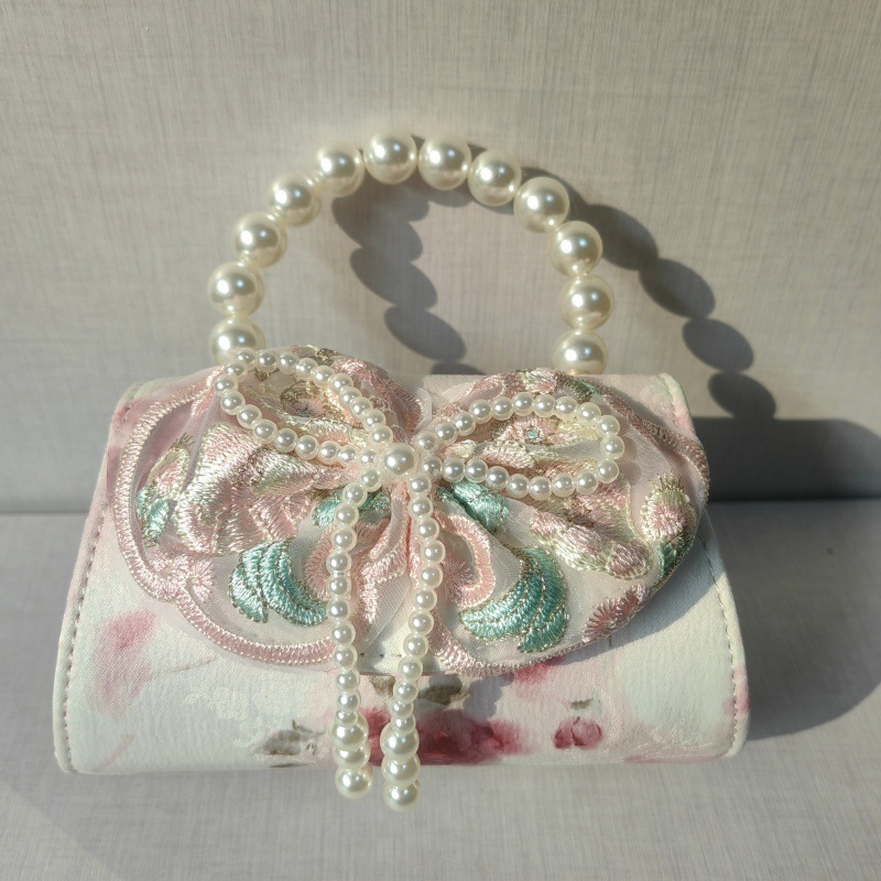 2025 primavera y verano estilo caliente moda casual niños dulces bolsa de gelatina mini bolso de mensajero de un solo hombro variedad al por mayor