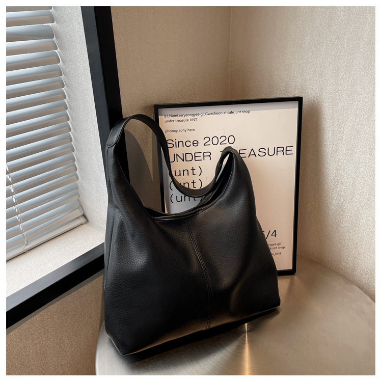 Bolsos de gran capacidad para mujeres primavera y verano 2025 nuevos bolsos de hombro de moda de alta calidad cubos de agua para niños y madres bolsa especial de cercanías