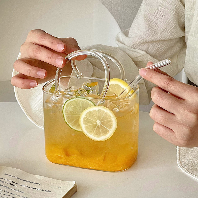 Bolso de vidrio en línea taza de té de frutas de verano transparente creativa extraña de alto valor de la cara taza de cóctel de jugo de fruta