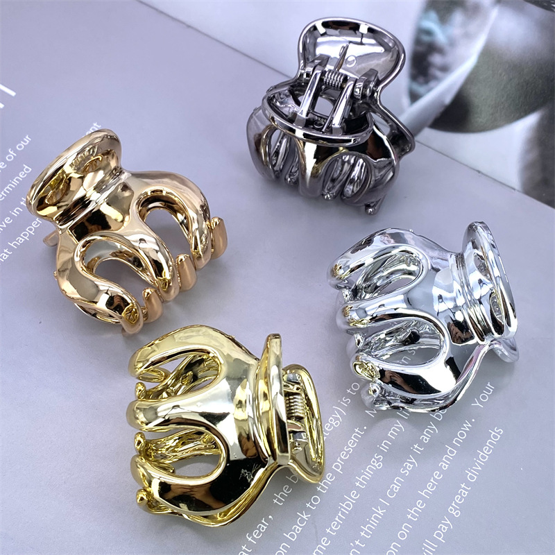 Galvanoplastia PC material continuo galvanoplastia uv4 color aumento de la altura horquilla tamaño pequeño agarre Clip 2 yuanes tienda física accesorios para el cabello accesorios de cabeza