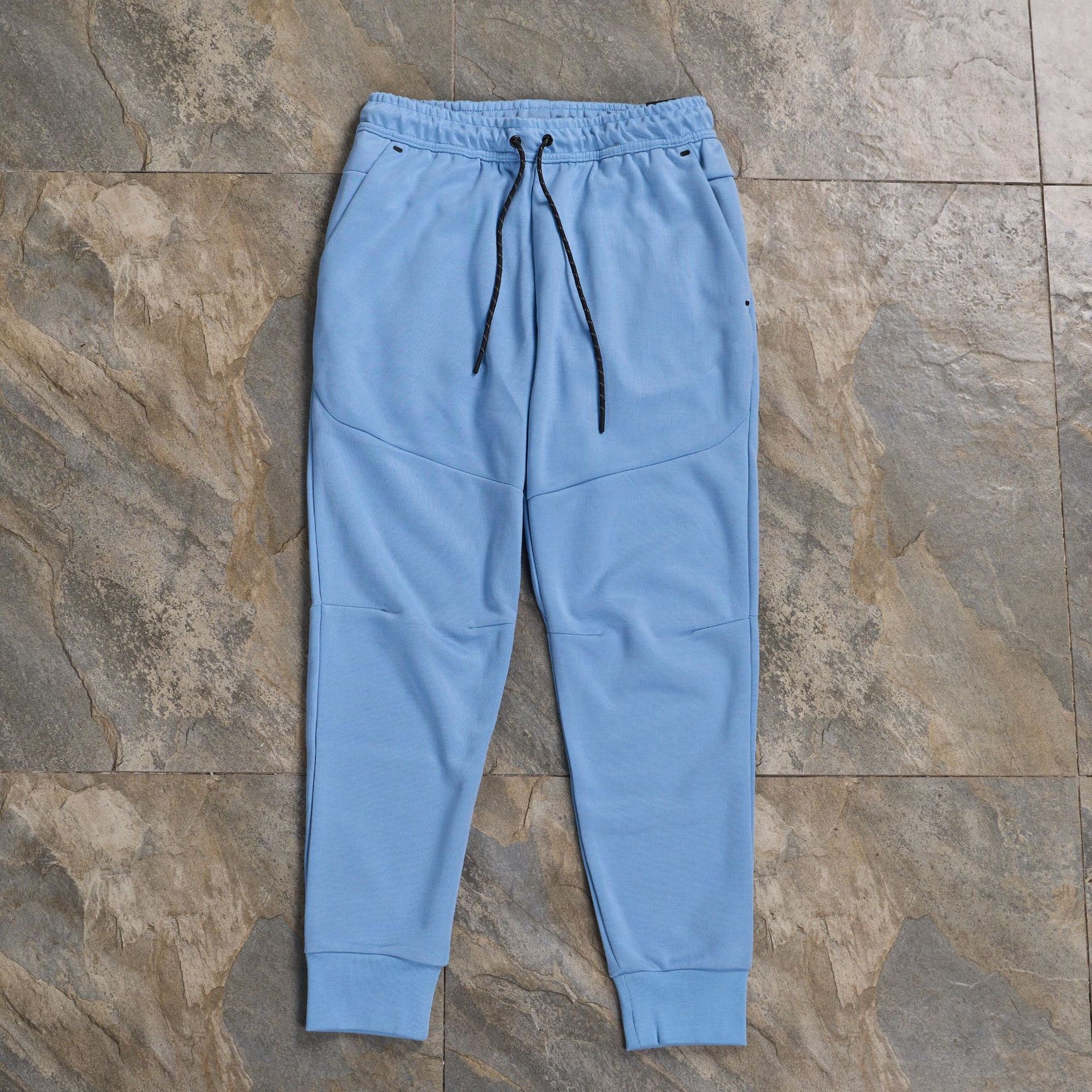 Pantalones casuales deportivos primavera y otoño aire laminado de algodón con cremallera pantalones deportivos para hombres y mujeres