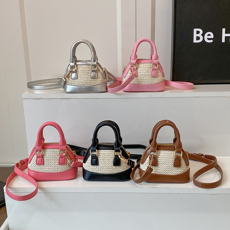 Bolso de hombro para niños y niñas de color de contraste de moda coreana, mini bolso de bebé tejido de paja de estilo occidental, nuevo bolso de mensajero para niños