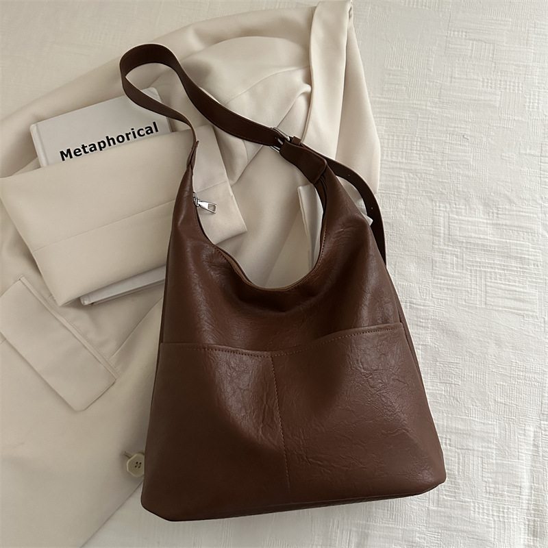 Bolso de mujer 2024, nuevo otoño y invierno de alta calidad, bolso de brazo de viaje simple, bolso de hombro de gran capacidad para mujeres.