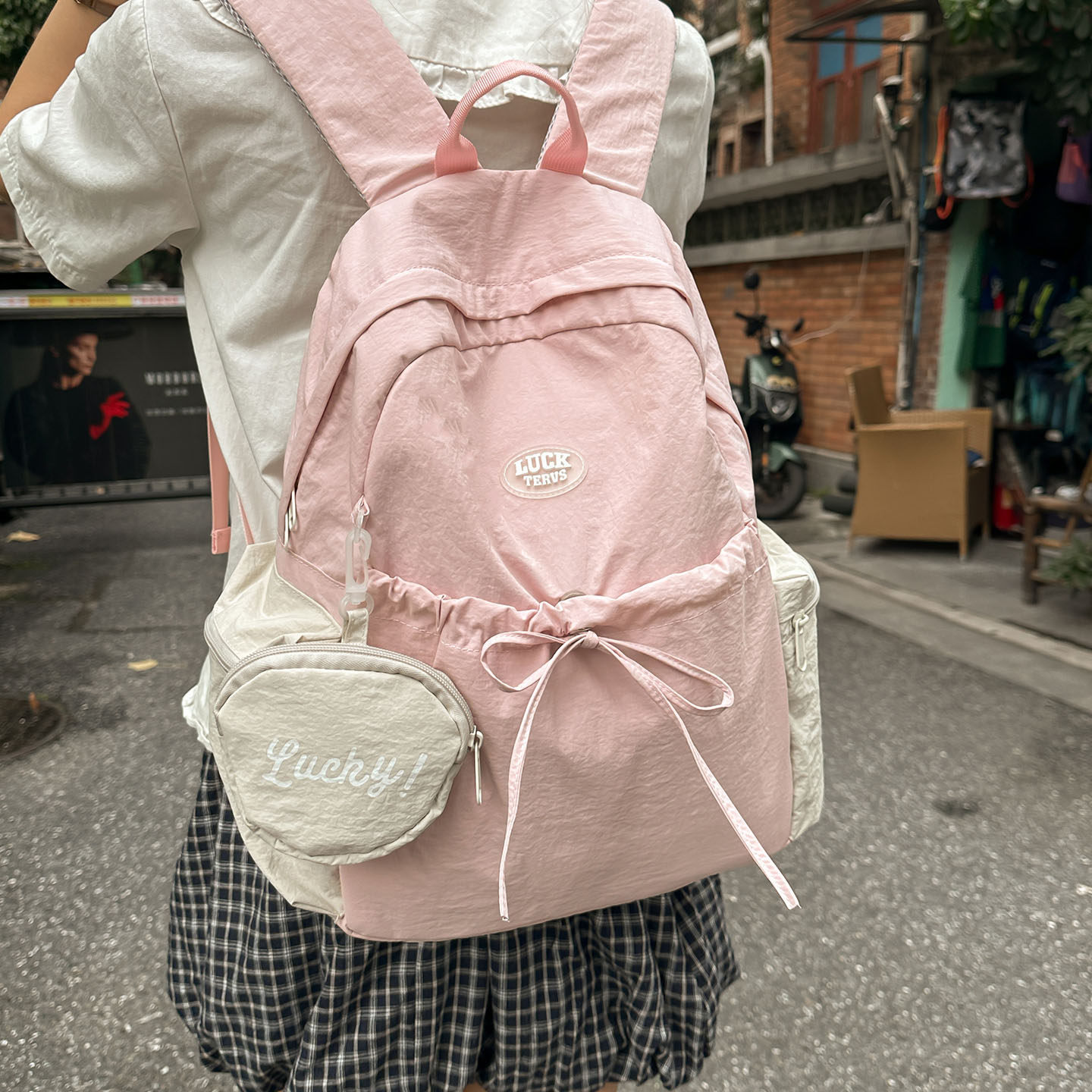 Bolsa de verano universitaria de viaje versátil 2026 mochila de viento para mujeres nueva linda mochila de gran capacidad para estudiantes universitarios