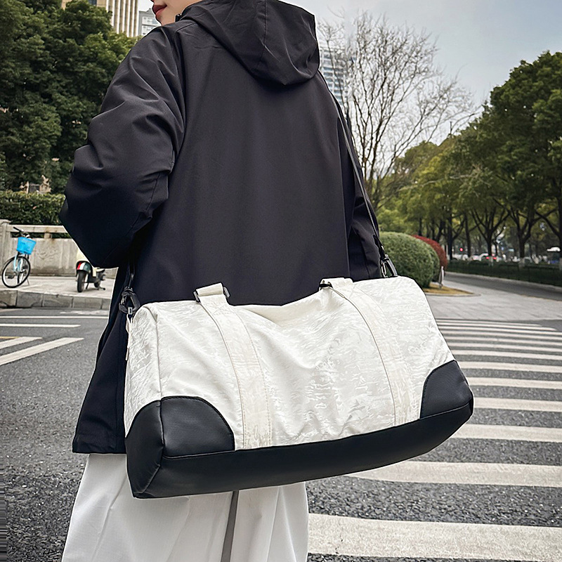 Bolsa de viaje de gran capacidad para mujer 2025 nueva bolsa de almacenamiento separada en seco y húmedo para fitness bolsa de equipaje de tirantes de viaje de negocios de corta distancia para hombre