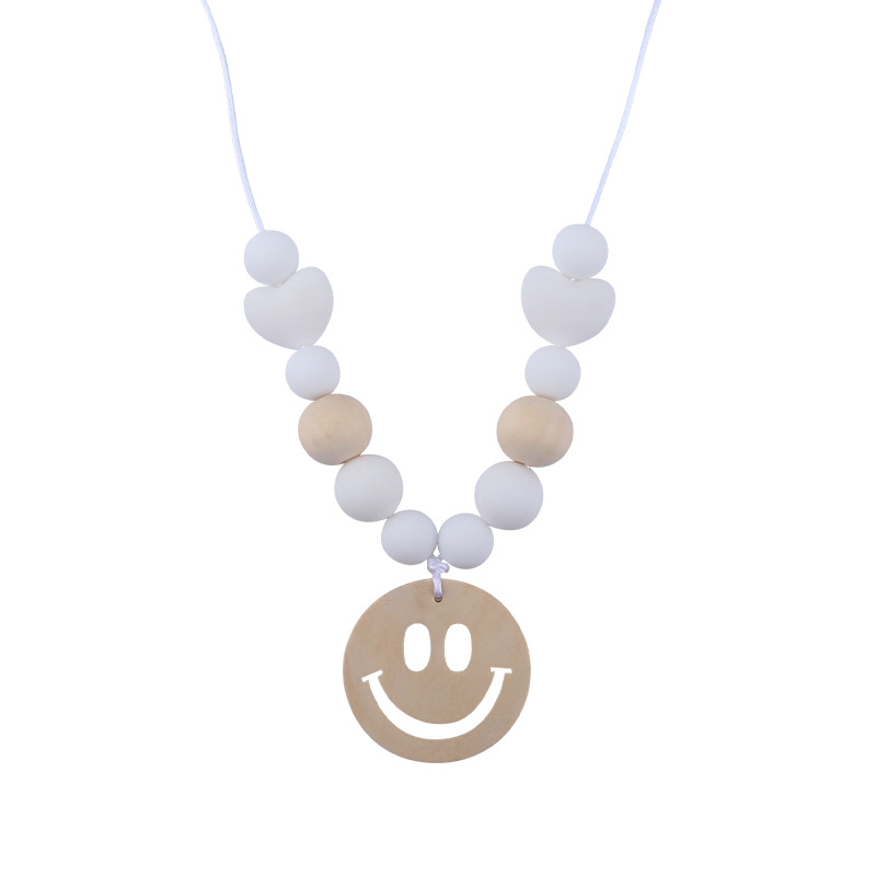 Nuevo bebé suministros smiley cara mordedor collar bebé cuentas de silicona mordida molar masticable colgante collar