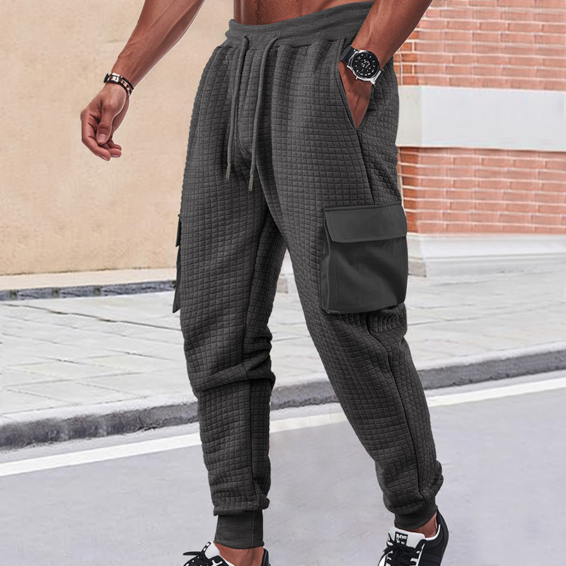 Nuevos pantalones deportivos de hombre de otoño transfronterizos europeos y estadounidenses gruesos pequeños cuadrados herramientas deportivas casuales pantalones de pila