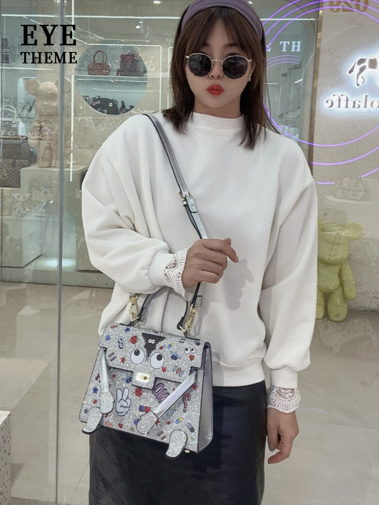 Personaje de dibujos animados para damas, nuevo bolso de solapa con forma peculiar, diseño de cerradura impresa, bolso diagonal de nicho