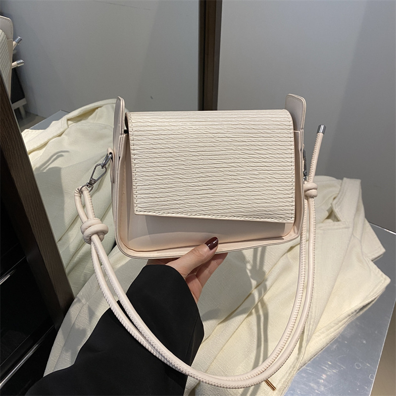 Bolsos de brazo de textura coreana retro mujeres 2025 primavera nueva moda de nicho de alta capacidad bolso de hombro