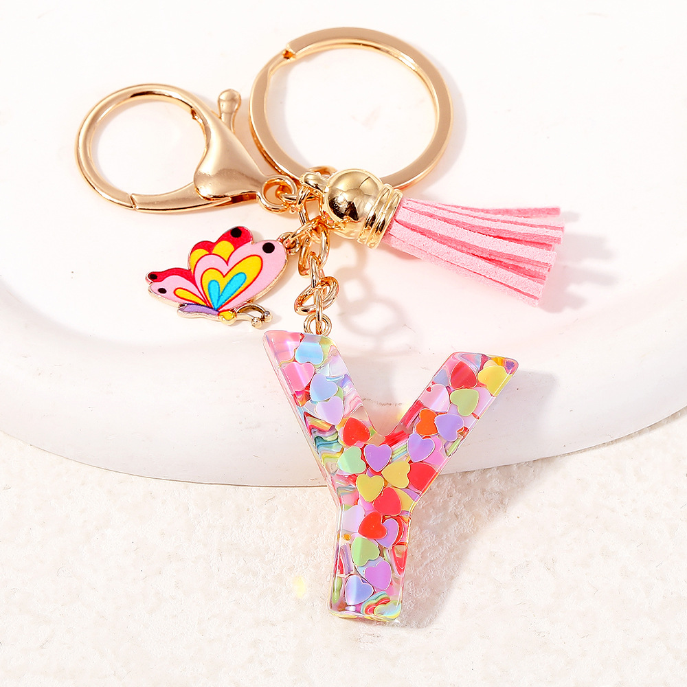 2024 puntos transfronterizos de resina de sequilla rosa 26 letras inglesas llavero colgante mariposa fringe accesorios