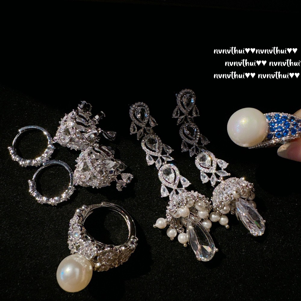 Earrings drop-shaped pearl with zircon